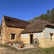 160SQM STONE HOUSE WITH GARAGE REQUIRING COMPLETION. EDGE OF A PRETTY VILLAGE 10MINS FROM LE BUGUE. GARDENS OF 1696SQM. LOVELY STREAM AND WIDE COUNTRYSIDE VIEWS. PF90309